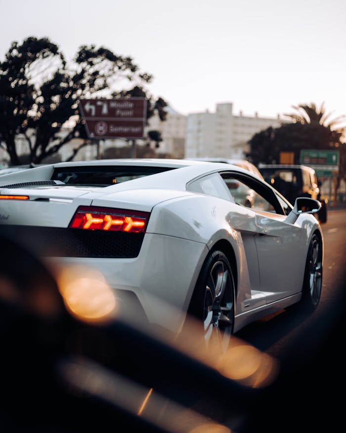 White Sportscar travelling the Road